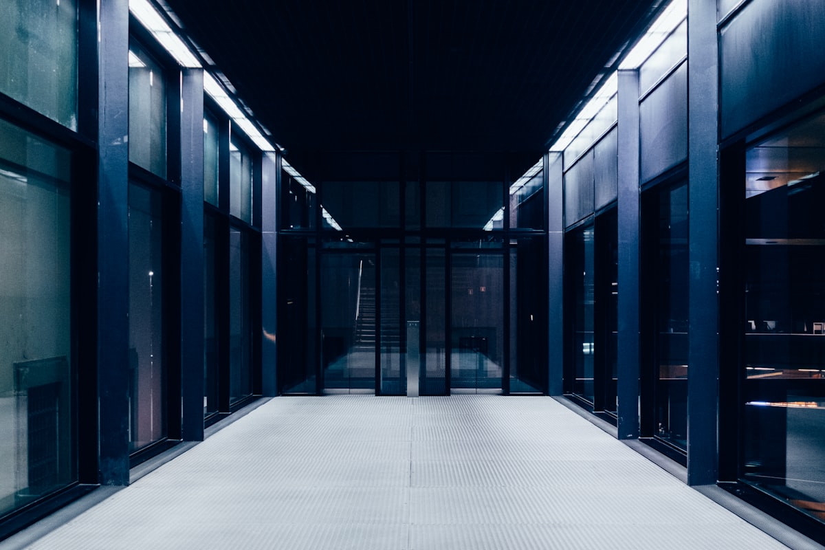 Data centre corridor behind glass doors